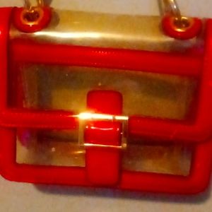 It's a red clear purse never got used